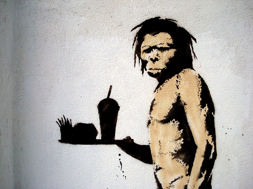 The Problem with Paleo - Banksy's Caveman Copyright Flickr https://www.flickr.com/photos/lord-jim/2245362817/sizes/o/ - Reused with permission through the Creative Commons License https://creativecommons.org/licenses/by/2.0/
