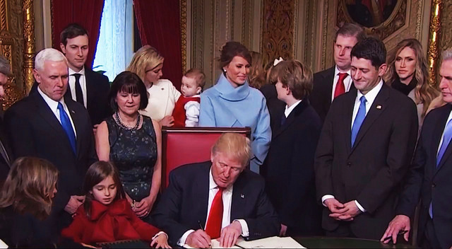 President Donald Trump signs many environment killing executive orders in his first week. Photo Credit:  Karl-Ludwig Poggemann, Flickr
