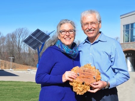 Holly and George Stone, principals of GreenStone Ventures, the developers of Clarksville Commons, proudly display their 2017 Wintergreen Award for Excellence in Green Building by the United States Green Business Council (USGBC) Maryland. 